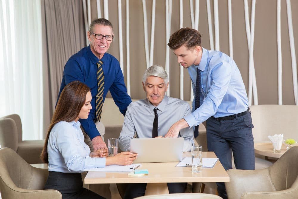 five-business-people-working-at-table.jpg